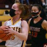 Kara Marecle became the seventh player in the history of White River girls' basketball to score more than 1,000 points. Here, she drives for two more during Friday night's home victory. Photo by Kevin Hanson