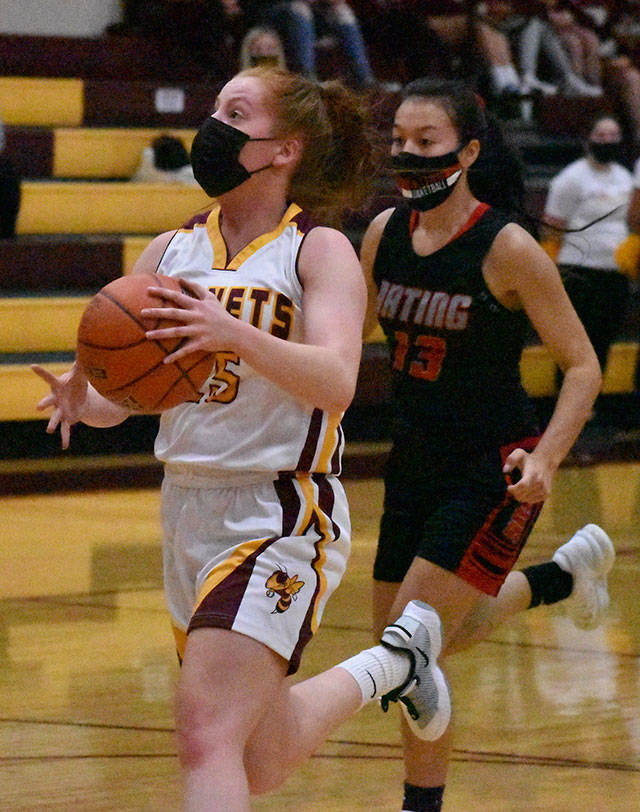 Kara Marecle became the seventh player in the history of White River girls basketball to score more than 1,000 points. Here, she drives for two more during Friday nights home victory. Photo by Kevin Hanson