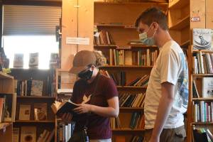 Colette Sweers, left, and her boyfriend Trevor Curley spent part of their day in Enumclaw June 2 shopping at The Sequel Books.