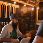 Sean McDonald, owner, and Sam Smith, beertender, serve drinks on a busy Friday afternoon at Cole Street Brewery. Photo by Alex Bruell