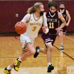PHOTOS BY KEVIN HANSON Boys basketball teams from White River and Enumclaw battled in the opening round of the SPSL 2A tournament, with the winner advancing to the tourney championship the following night. Playing on their home floor, the White River crew emerged victorious. At left, Wyatt Glissmeyer (3) heads upcourt, trailed by Enumclaws Carson Firnkoess (11). At right, Enumclaws John Leonard looks to get past the defense of White Rivers Will Schroeder.