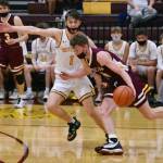 PHOTOS BY KEVIN HANSON Boys basketball teams from White River and Enumclaw battled in the opening round of the SPSL 2A tournament, with the winner advancing to the tourney championship the following night. Playing on their home floor, the White River crew emerged victorious. At left, Wyatt Glissmeyer (3) heads upcourt, trailed by Enumclaws Carson Firnkoess (11). At right, Enumclaws John Leonard looks to get past the defense of White Rivers Will Schroeder.