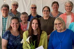 Local P.E.O. members pose for a picture with Isabella Hoyer, who recently won a scholarship from the women's organization. Front row, from left to right: Nancy West, Dawn Hoyer (Isabella's mother), Isabella, and Cherl Schneider. Middle row: Cherie Murchie, Sue Vannatter, Heidi Russell, and Kay Raeder. Back row: Sue Reiter, Linda Irrgang, Linda Fisher, Eva Dietz, and Martha Blodgett. Photo taken by Maggie Baumann, courtesy P.E.O.