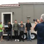 PHOTO BY KEVIN HANSON
Former EHS teacher Bob Kilmer snaps a photo of the tiny house his students created. The home will now used by those advocating for small-home living. Some of the students involved in the project gathered Friday with Todd McKellips (left), director of the Washington Tiny House Association.