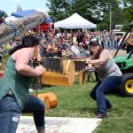 In this Courier-Herald file photo, two Buckley Log Show contestants team up to see which couple can hand-saw through a log the fastest. Photo by Ray Miller-Still