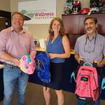 Metropolitan King County council member Reagan Dunn, Rainier Foothills Wellness Foundation Executive Director Sara Stratton and Enumclaw Mayor Jan Molinaro pose for a picture at the Foundations Enumclaw office. Photo provided by Dunns staff.