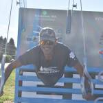 Photo by Alex Bruell 
Francisco Pons demonstrates his upper body strength at one of the Fitness Court facilities.