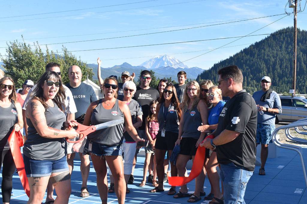 Photo by Alex Bruell
Enumclaw Park Board chairperson Kelly OKelly cuts the proverbial ribbon at Enumclaws new Fitness Court, a free public outdoor mini-gymnasium.