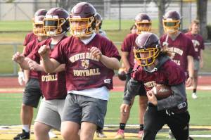 PHOTOS BY KEVIN HANSON Football teams at Enumclaw and White River have been practicing since Aug. 18, preparing for Fridays season openers.
