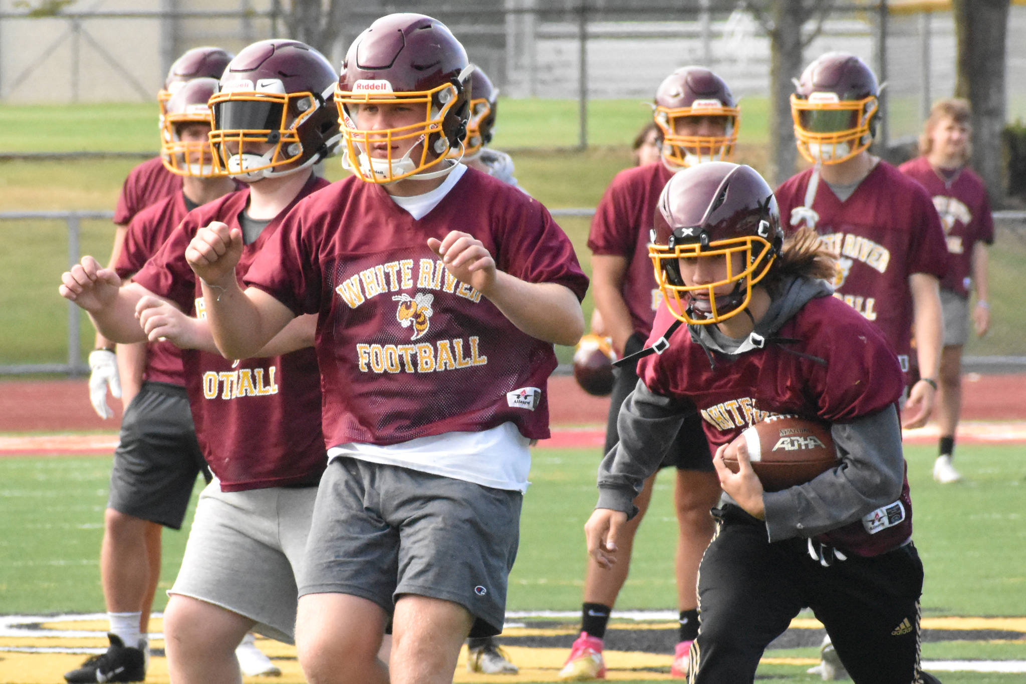 PHOTOS BY KEVIN HANSON Football teams at Enumclaw and White River have been practicing since Aug. 18, preparing for Fridays season openers.