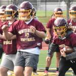 PHOTOS BY KEVIN HANSON Football teams at Enumclaw and White River have been practicing since Aug. 18, preparing for Fridays season openers.