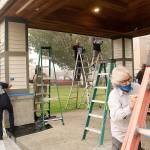 Photo by Ray Miller-Still 
Despite bad air quality last year, more than 60 volunteers donned their masks and got to work making Enumclaw a more beautiful place to live, including repainting the Rotary Park gazebo.