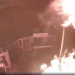 This image, taken from a video shared by the King County Sheriffs Office, shows the conflagration started by an unknown person on the porch of an Enumclaw household. A link to the video is included in the article.