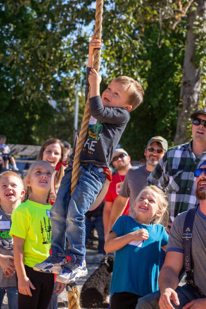 Liam Clinkingbeard climbs up the rope. Photo by Ashley Britschgi.