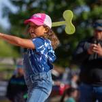 Jaeda Walker eyes her wooden ax throw. Photo by Ashley Britschgi.