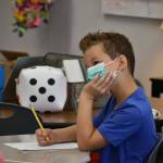 A student in Jody Emersons third grade class at Southwood Elementary listens in. Photo by Alex Bruell