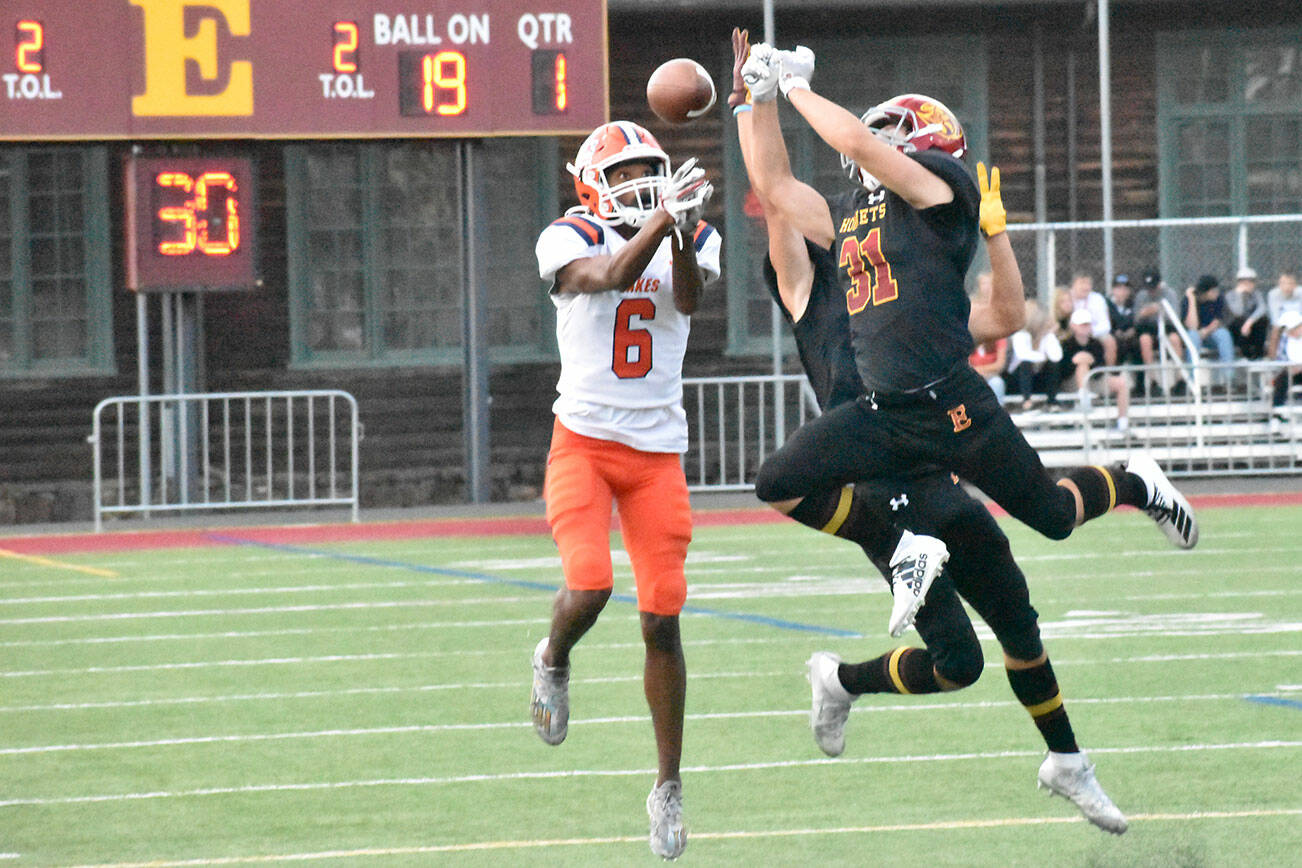 PHOTO BY KEVIN HANSON
Enumclaw High defensive back Emmit Otero goes high to deflect a Lakes pass attempt during the early stages of Thursday night's Hornet victory.