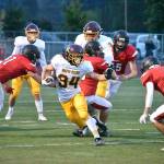 White River High's Payne Plaster evades Orting defenders, picking up a nice gain during Friday night's road game. The outcome didn't go the Hornets' way as the Buckley squad fell to 1-2 on the season. Photo by Kevin Hanson
