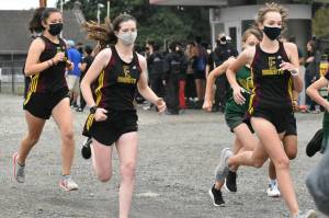 PHOTOS BY KEVIN HANSON The Enumclaw High cross country program hosted its only home meet of the season on the afternoon of Sept. 22. The Hornets hosted Washington and Foss high schools, competing on the 3.1-mile course at the Enumclaw Expo Center. The EHS boys defeated the Washington Patriots, while Foss entered only one runner. On the girls side, Washington was the automatic winner as both Enumclaw and Foss could not field a full team. In these photos, Enumclaws Evan Cheney, left, and Trevor Storm are at the front of the pack (and went on to claim first and second place, respectively). Shown at the start of the girls race are, from left, Enumclaws Ahna Lemeshko, Lindsay Essex and Ava Sawyer. For details about the South Puget Sound League 2A meet, see Sports Roundup.