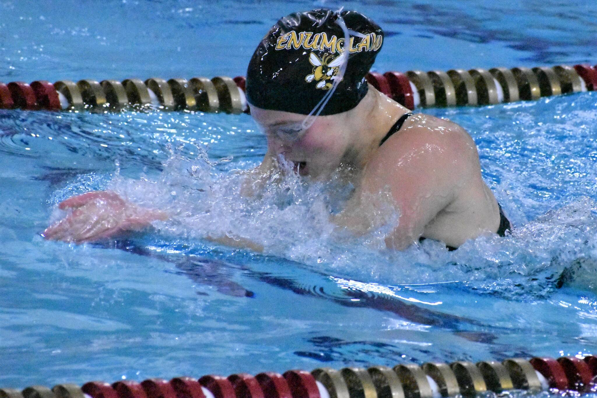 PHOTOS BY KEVIN HANSON
Swimmers and divers from Enumclaw and White River gathered Thursday afternoon for a virtual meet against the Steilacoom Sentinels. The Plateau athletes registered times and totals at the Enumclaw Aquatic Center and Sentinels coaches did the same on their end. Numbers were merged and results tallied (find details in Sports Roundup). Shown here are White River diver Mackenzie Hale and, doing the breaststroke, Enumclaw's Anna Bogh.