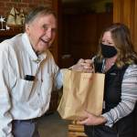 Hugh Lyman poses for a picture with RFWF volunteer Michelle Apodaca. Photo by Alex Bruell.