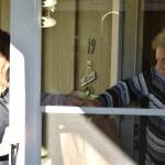 ..RFWF volunteer Michelle Apodaca delivers a set of meals to Marlene Smith. Photo by Alex Bruell