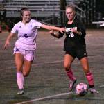 Enumclaws Raegan Eilers keeps possession as she battles Fifes Maya Knautz during an Oct. 14 contest at the Expo Center. Photo by Kevin Hanson