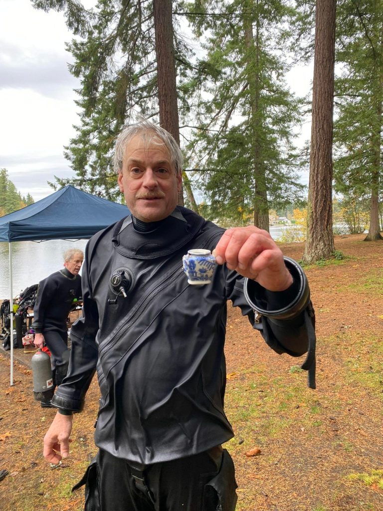 Photo courtesy Jim Hackiewicz 
Tony Beaumont shares a tiny piece of pottery found in the water in Lake Sawyer.