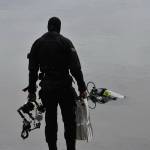 A diver prepares to enter Lake Sawyer.