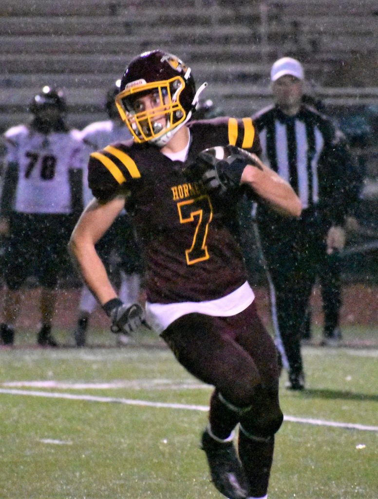 White River senior Nate Peckham turns the corner for good yardage during Thursday nights victory over Franklin Pierce.