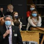 WRSD assistant superintendent Scott Harrison speaks to parents with members of the Foothills musical groups behind him.