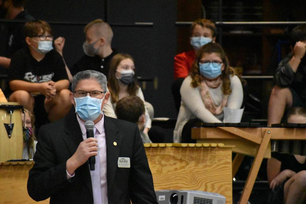WRSD assistant superintendent Scott Harrison speaks to parents with members of the Foothills musical groups behind him.
