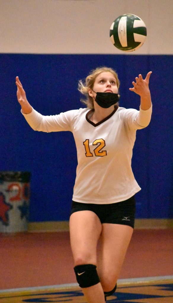 Macy Furtwangler serves during Enumclaws 3-0 district victory against the Sammamish Redhawks.