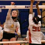 Enumclaw senior Rosie Penke registers a kill during the Hornets district victory over Sammamish. Guarding the net is the Redhawks Akshar Ameir.