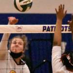 Enumclaw senior Rosie Penke registers a kill during the Hornets' district victory over Sammamish. Guarding the net is the Redhawks' Akshar Ameir. Photo by Kevin Hanson