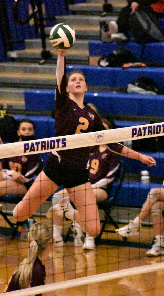 Elle Thomas goes high for a kill against North Kitsap, White Rivers first opponent during last weeks district tournament. Photo by Kevin Hanson