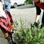 John Ryan Shumway, 3 and a half years old, shows off his toy chainsaw. Photo by Alex Bruell