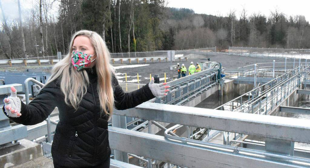 The trap-and-haul facility is designed to pull about 60,000 fish a day during pink run years from the White River and safely move them to a spot above Mud Mountain Dam. Pictured is Project Manager Leah Hauenstein explaining operations on the upstream side. Photo by Kevin Hanson