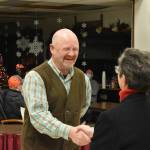Beau Burkett and Pat Johnson shake hands after concluding the oath of office. Photo by Alex Bruell