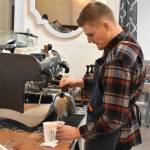 Hunter March prepares a drink at Anchor House Coffee Roasters.