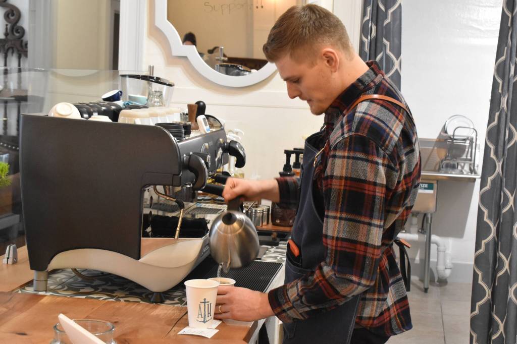 Hunter March prepares a drink at Anchor House Coffee Roasters.