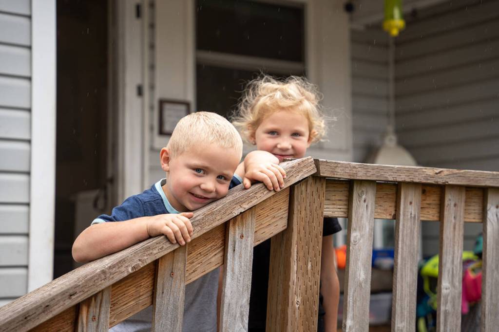 Remi (right) and Ryker helped Guardian Roofing with their familys attic renovation, and now have a clean, safe playroom.