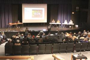 More than a dozen local residents  including students  spoke at the Nov. 22 Enumclaw School Board meeting, while audience members, filling up half the high school auditorium, showed their support for speakers with enthusiastic applause. Photo by Ray Miller-Still