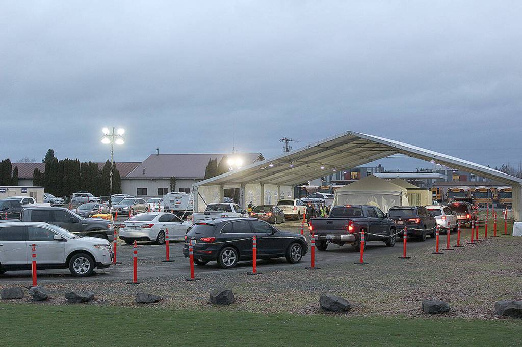 Expect long lines at the Enumclaw COVID testing site; one Enumclaw police officer on scene said the line sometimes stretches from the tent at 550 Semanski Street S., down McDougall Ave., and onto 244th Ave. SE, roughly a half mile away. Photo by Ray Miller-Still