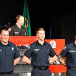 From left to right: Mitchell Oake, Ira Holt and Shane Muncaster stand after officially completing their training at the South King County Fire Training Consortium. Photo by Alex Bruell