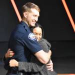 Photo by Alex Bruell
Ira Holt shares a hug with his wife LaToya Holt, who pinned his badge.