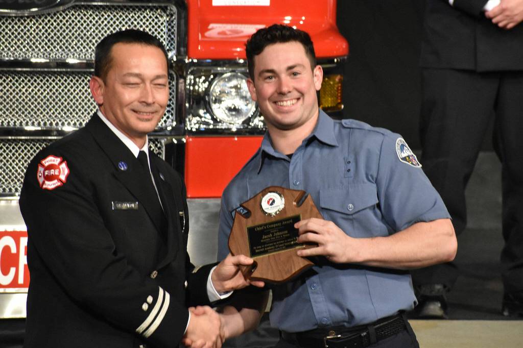 Photo by Alex Bruell 
Jacob Johnson of Mountain View Fire & Rescue accepts the Marty Hauer Physical Fitness award.