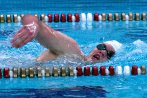 Enumclaw High swimmer McCade Walker competes in a freestyle event during a recent meet at the Enumclaw Aquatic Center.