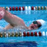 Enumclaw High swimmer McCade Walker competes in a freestyle event during a recent meet at the Enumclaw Aquatic Center. Photo by Kevin Hanson
