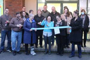 Avalanche Delite owner Debbie Montoya, in blue, with the Enumclaw Chamber of Commerce during a ribbon cutting late January. Photo by Ray Miller-Still